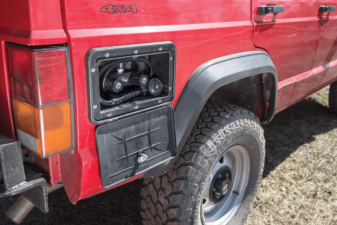 This overland XJ even has a custom pressurized hot water shower system