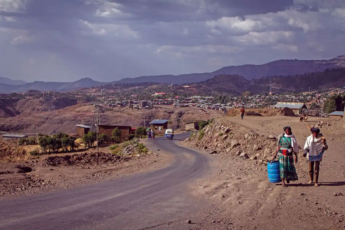Villagers in Ethiopia are seen carrying containers to get water