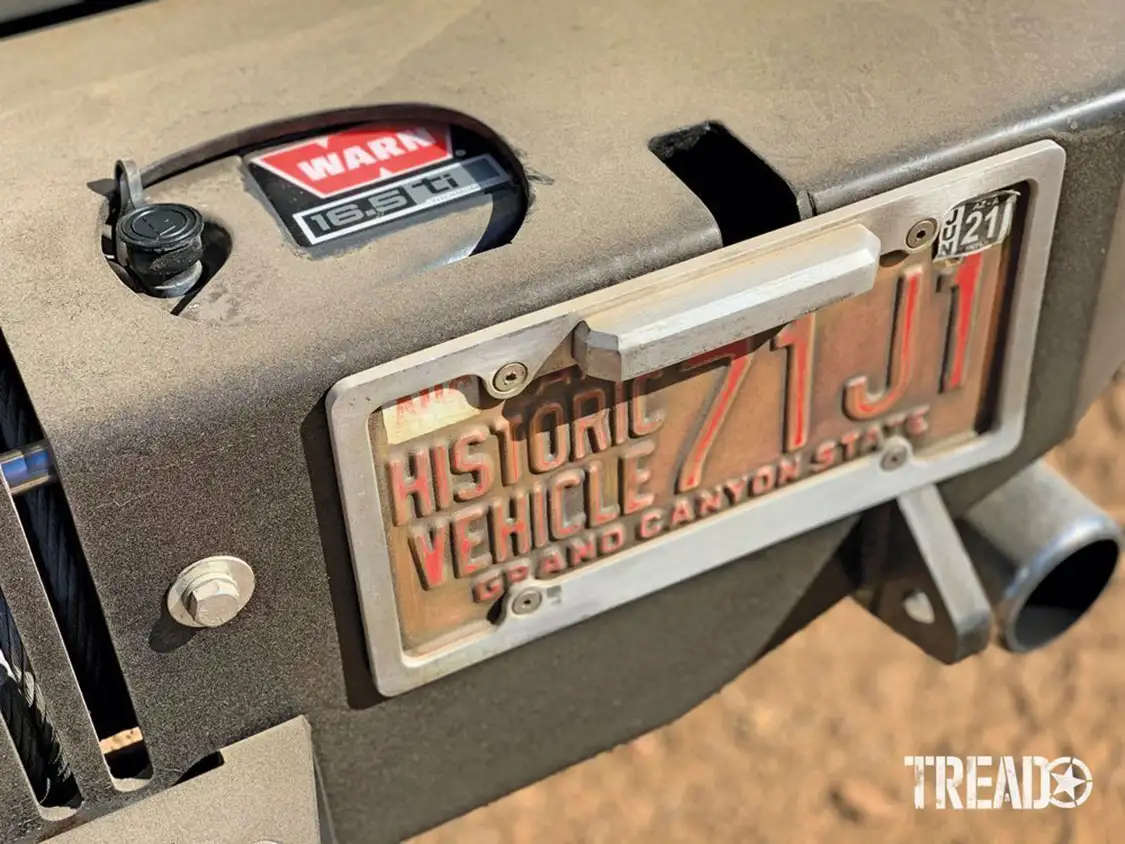 Vehicle license plate with J1 embossed on it