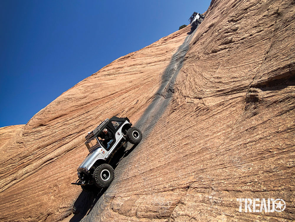 Denny Ghiringhelli’s Bandoola Willys carefully descends Moab’s famous Hell’s Revenge trail.