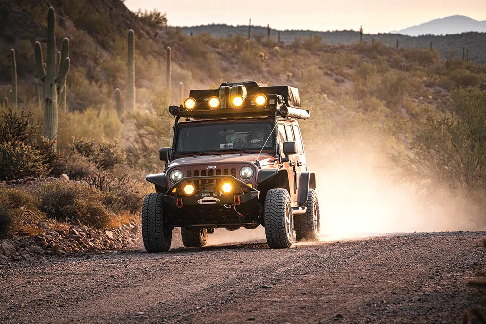 Six individual round Hard Korr lights cast a yellow glow on the trail ahead
