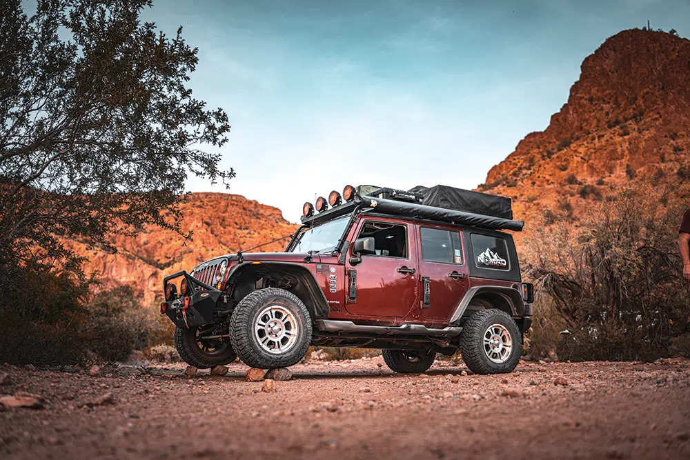A Smittybuilt front bumper adds protection to the front of the Jeep