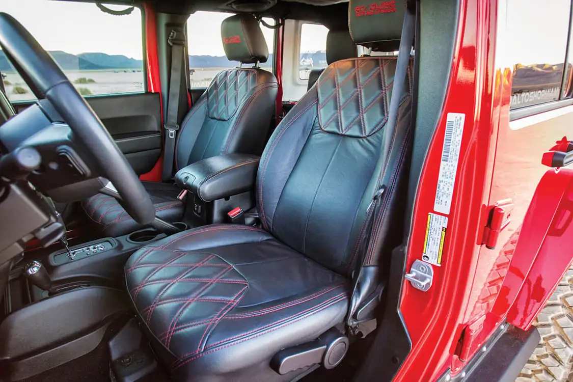 Roadwide replaced the stock upholstery with top-grain leather and hand-sewn red stitching.